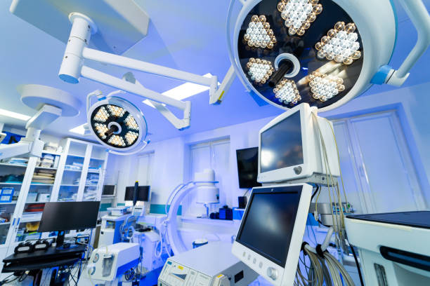 Neurosurgery OR setup. Advanced neurosurgery operating room equipped with modern surgical lights and medical equipment for patient care.